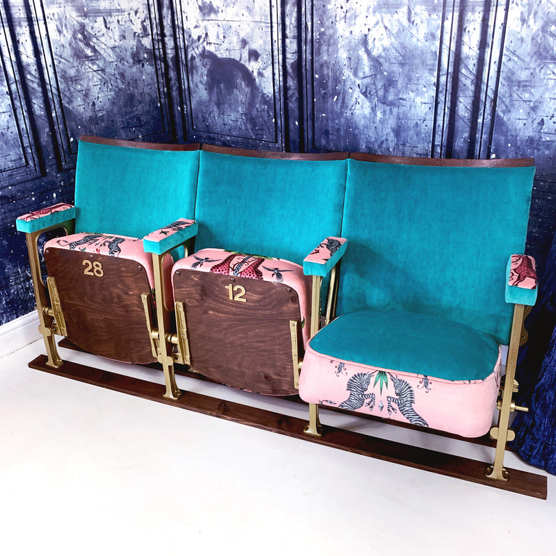 A row of three vintage cinema seats upholstered in Linwood Omega Velvet and Creatura velvet by Emma Shipley