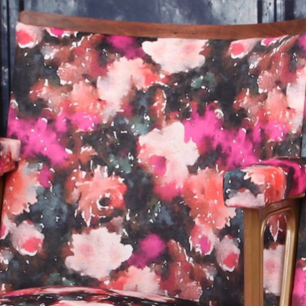 Set of two vintage cinema seats upholstered in pink floral rose velvet, with hot pink paneling and piping.